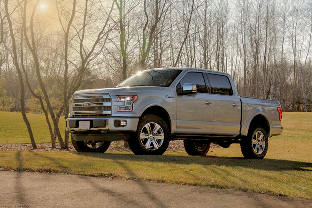 Silver Ford F-150 pickup truck parked outdoors, highlighting lightweight aluminum use in automotive design.