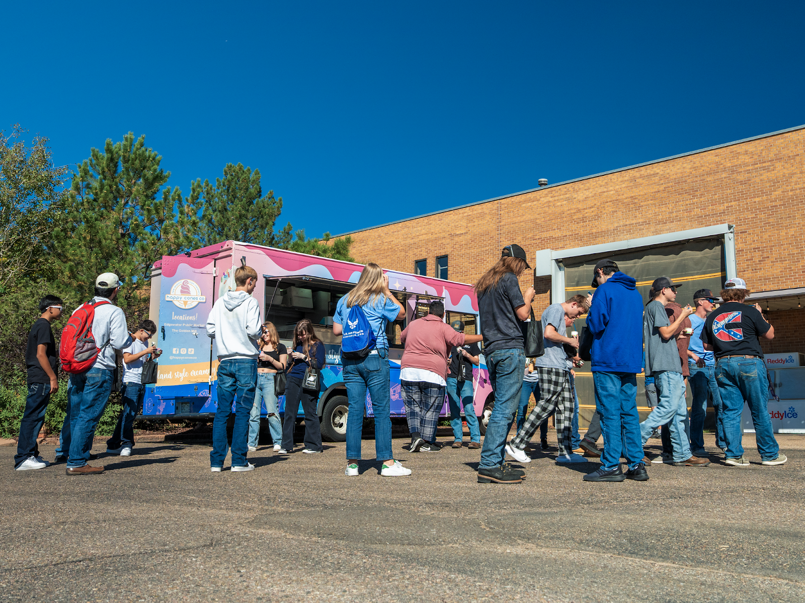 Guests of Golden Aluminum's Manufacturing Day 2025 celebration gather outside for New Zealand ice cream.