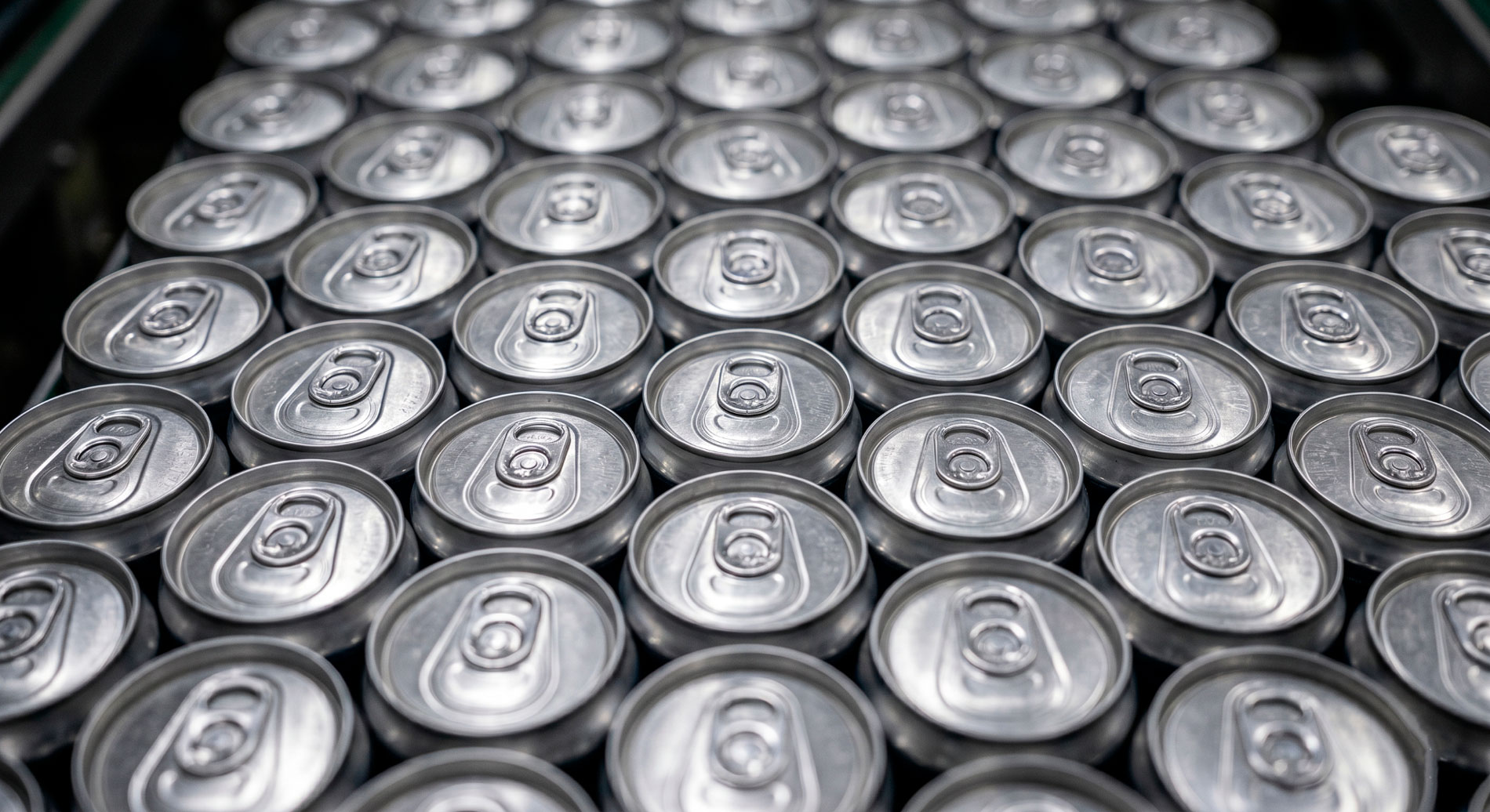 Overhead view of rows of aluminum beverage cans illustrating the scale of aluminum's dominance in global beverage packaging